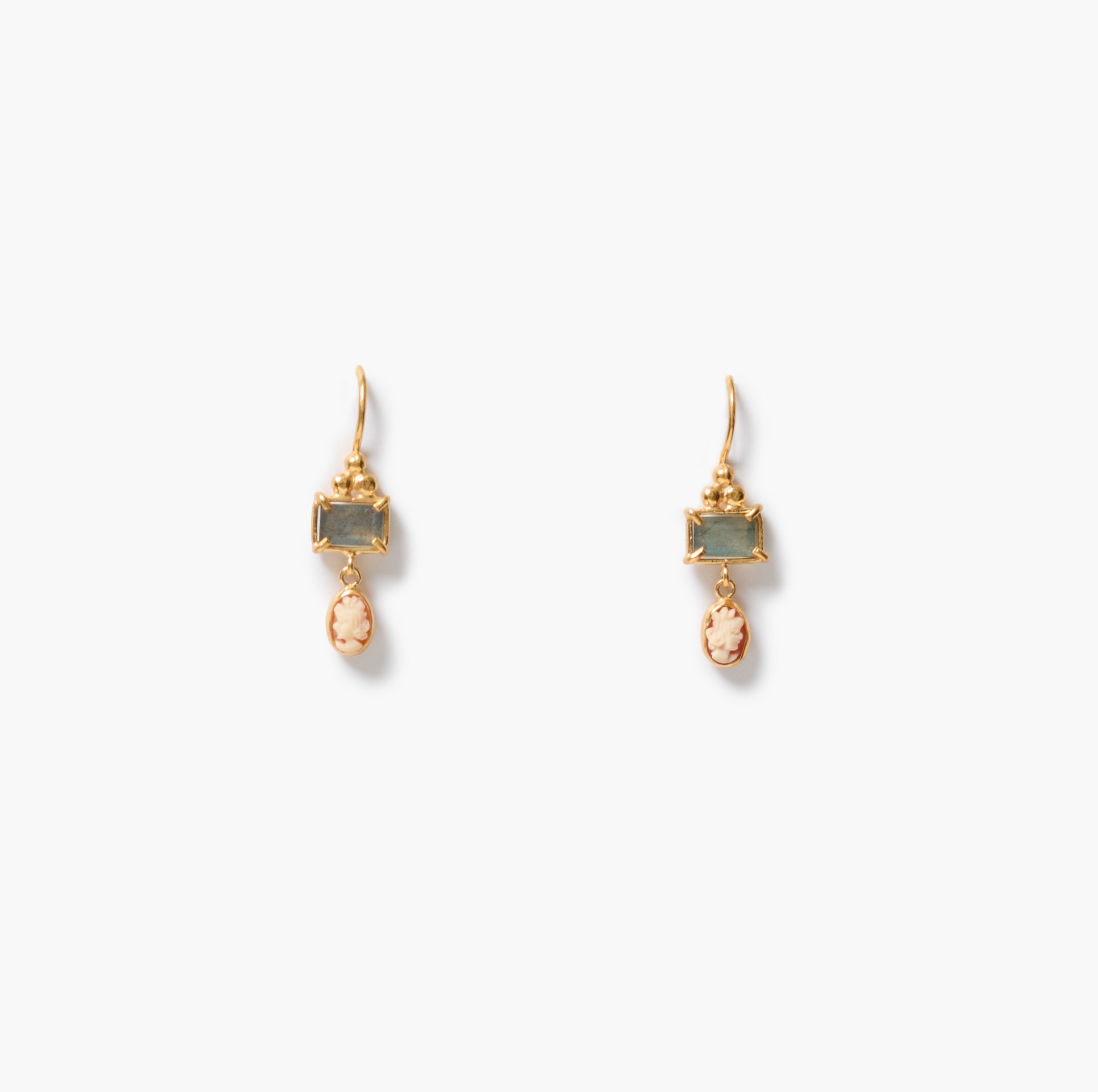 A pair of gold drop earrings featuring rectangular labradorite gemstones and teardrop-shaped peach-pink cameos with woman's face on each one, displayed on a clean white background.