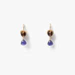 A pair of gold drop earrings featuring a round smokey quartz stone and a faceted iolite dangle, shown on a clean white background.