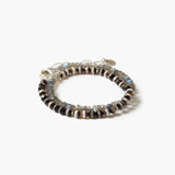 A beaded stretch bracelet featuring a mix of dark brown, black, and silver-toned beads with small iridescent blue-green accents, displayed on a clean white background.