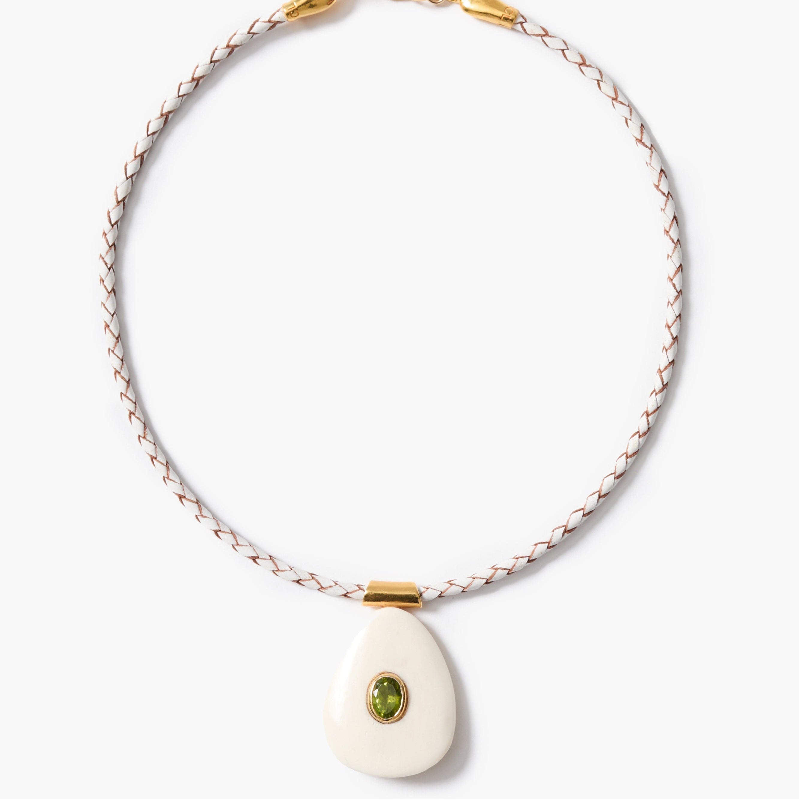 Necklace with a white pendant and peridot inlay on a white background