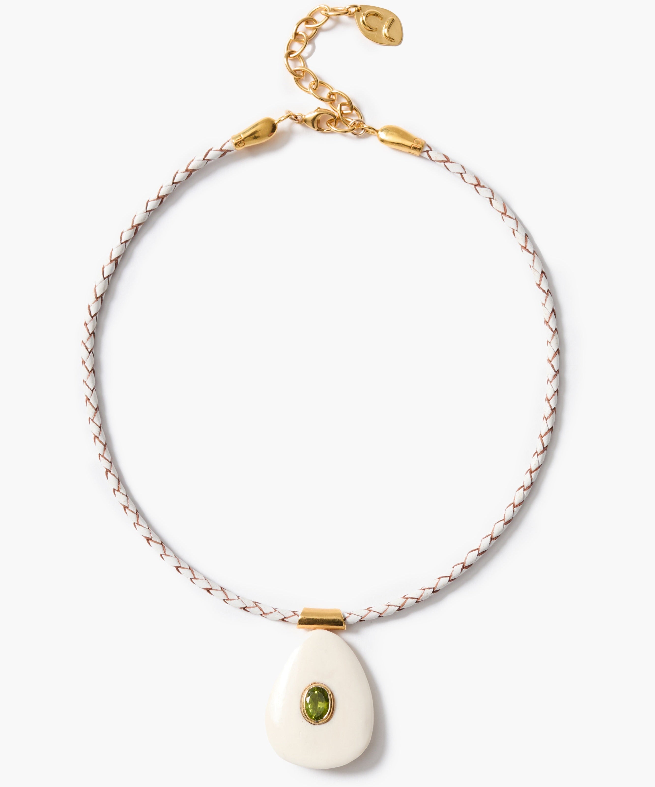 Necklace with a white pendant and peridot inlay on a white background